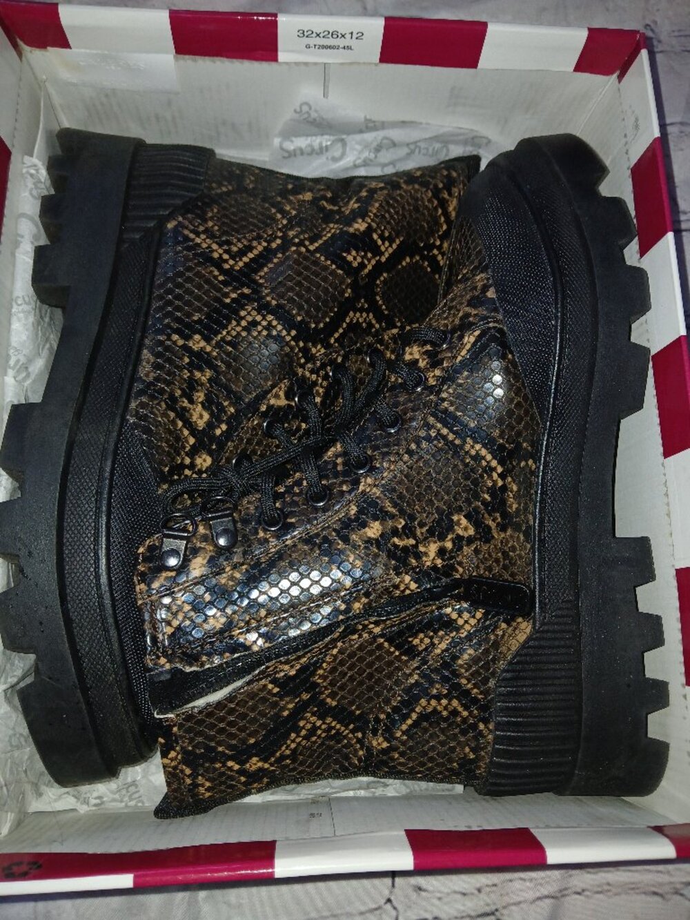 Snakeskin lace up lug boots